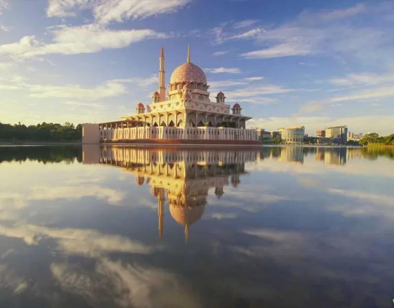 Reflection of a building by a lake