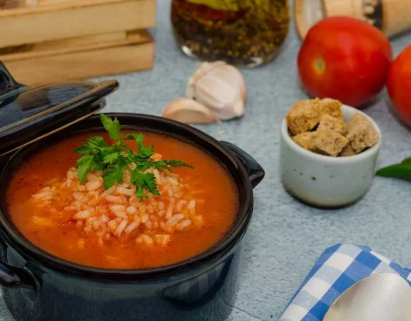 rice soup near croutons garlic and tomatoes