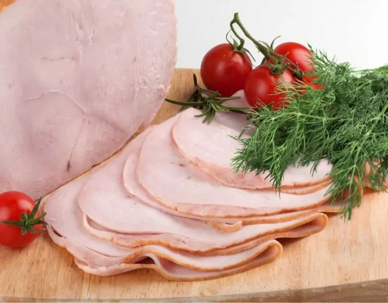 Sliced smoked turkey breast with dill