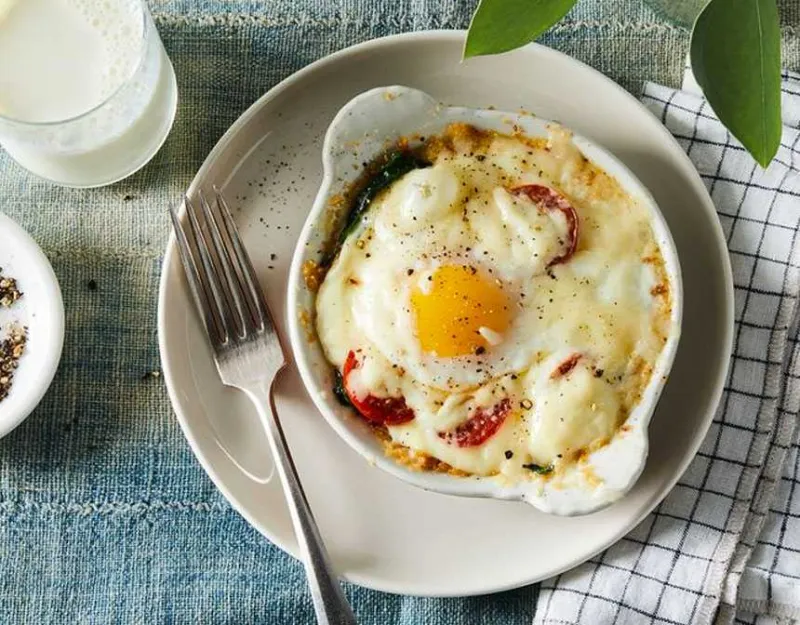 Baked eggs and sausage with cheese