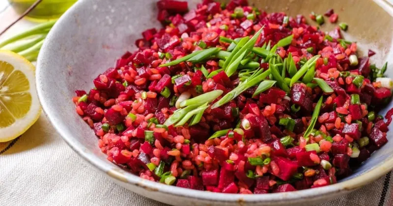 red beet bulgur salad in a bowl