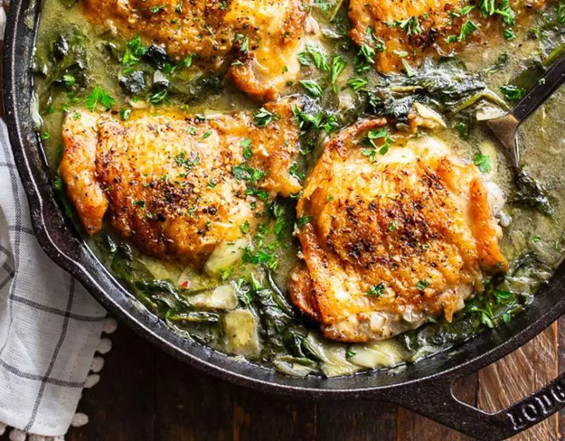 Spinach and chicken in a skillet