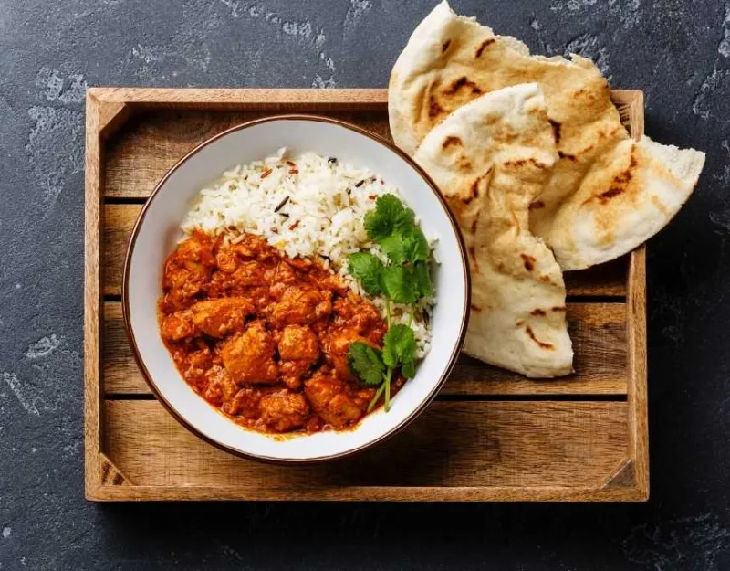 Chicken tikka masala with rice and naan