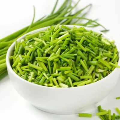 fresh chives in a white bowl