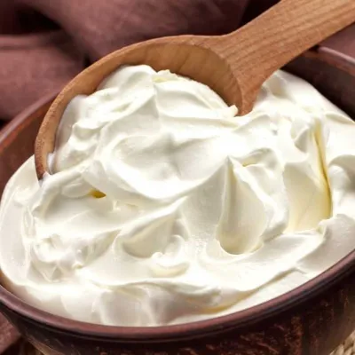 sour cream in a wooden bowl