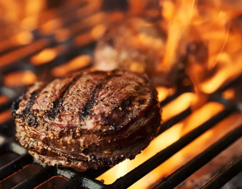 steak on a flaming bbq
